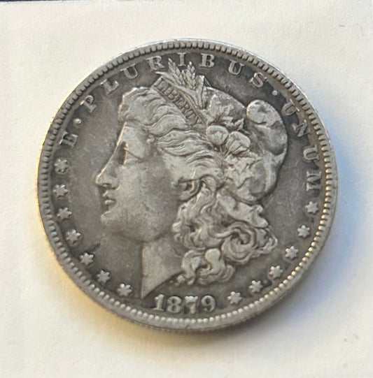 1879 Morgan Silver Dollar with dark toning. Beautiful detail. Great coin for collection.